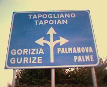 Road sign in Italian and Friulian