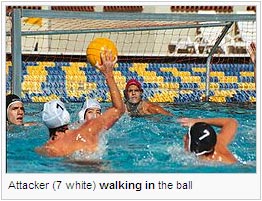 Attacker (7 white) walking in the ball