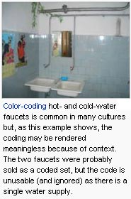 Color-coding hot- and cold-water faucets is common in many cultures but, as this example shows, the coding may be rendered meaningless because of context. The two faucets were probably sold as a coded set, but the code is unusable (and ignored) as there is a single water supply.