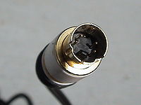 A standard 4-pin S-Video cable connector, with each signal pin paired with its own ground pin