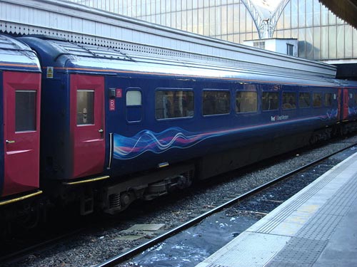 A BR Mk 3 coach in Neon livery