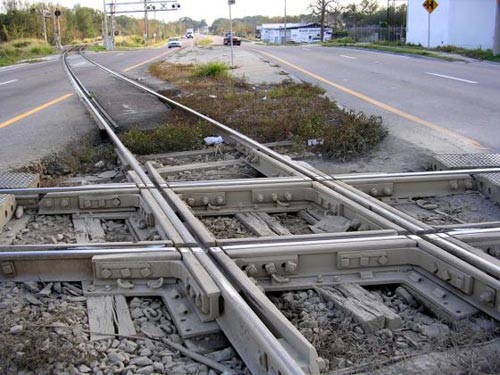 Railroad crossing at grade, also known as a diamond. This example is located in Mulberry, Florida
